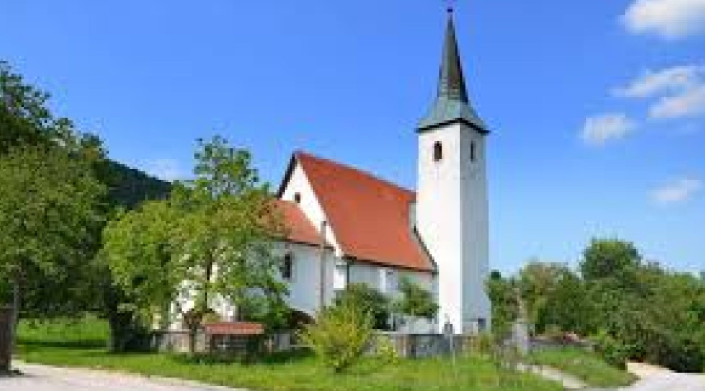 Ogled povečano sliko Župnijska cerkev sv. Mohorja in Fortunata v Podragi